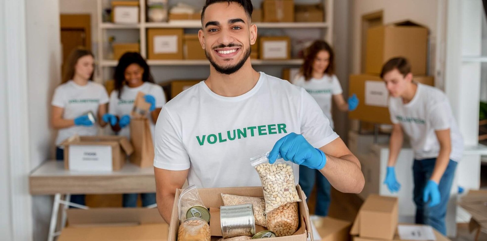 How to raise money online: 6 easy steps you should follow young arab volunteer working at charity center ho 2022 12 16 07 56 38 utc